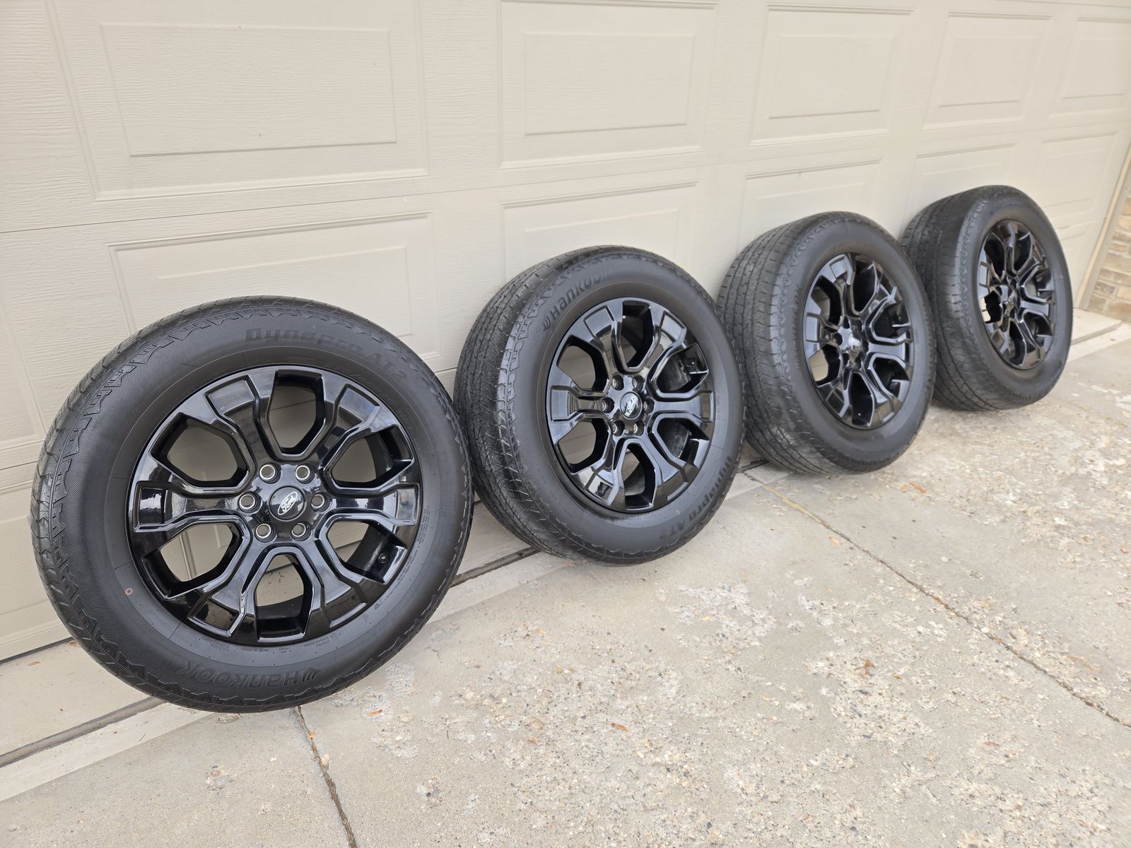 Set of 4 stock F-150 wheels and tires. Black 20" wheels. F150