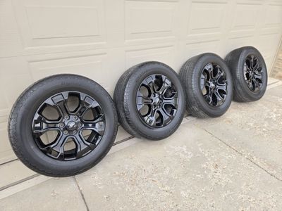 Set of 4 stock F-150 wheels and tires. Black 20" wheels. F150