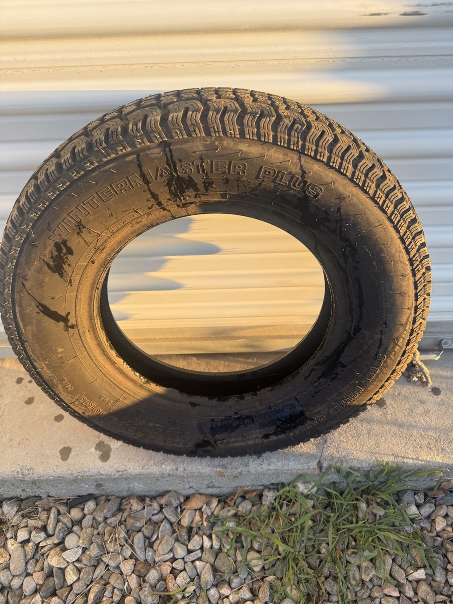 155/80/13 studded snow tire.