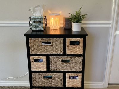 Black Storage Cabinet with Woven Wicker Baskets