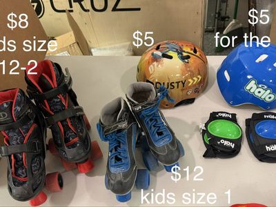 Different sized roller skates, helmets, knee, and elbow pads