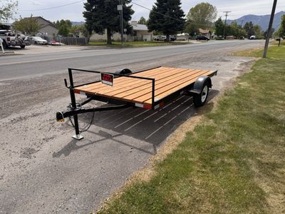 New Black Utility Tilt Trailer with Wood Deck - Perfect for Hauling and Transport