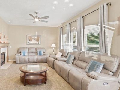 Excellent condition-Taupe Reclining Sofa, Loveseat & Recliner Set-Power Recline. Coffee table included!