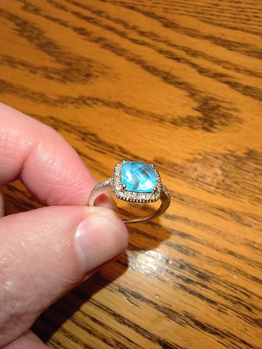 10k White Gold ring, blue topaz 1-3/8ct.  T.w. and diamond 1/5ct t.w. size 5.5