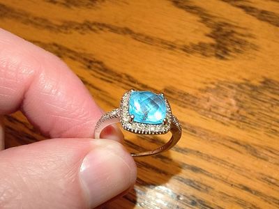 10k White Gold ring, blue topaz 1-3/8ct. T.w. and diamond 1/5ct t.w. size 5.5
