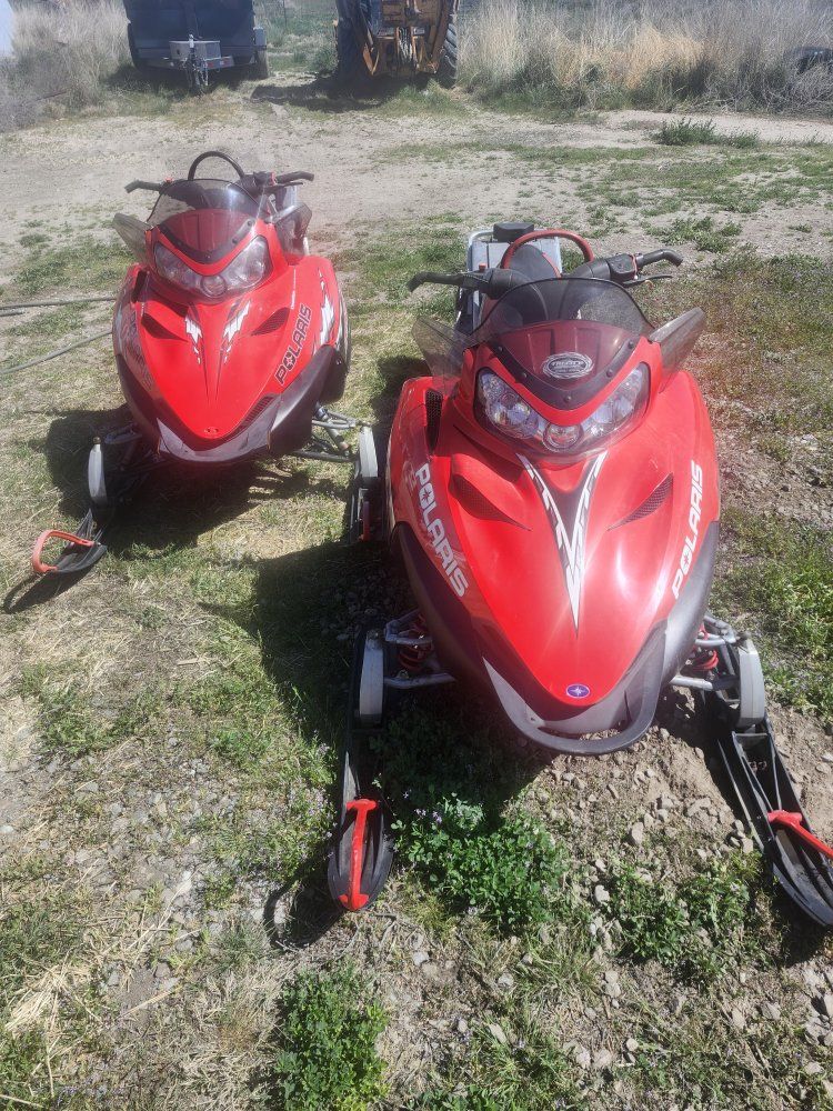 2 snowmobiles and enclosed trailer