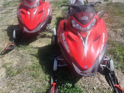 2 snowmobiles and enclosed trailer