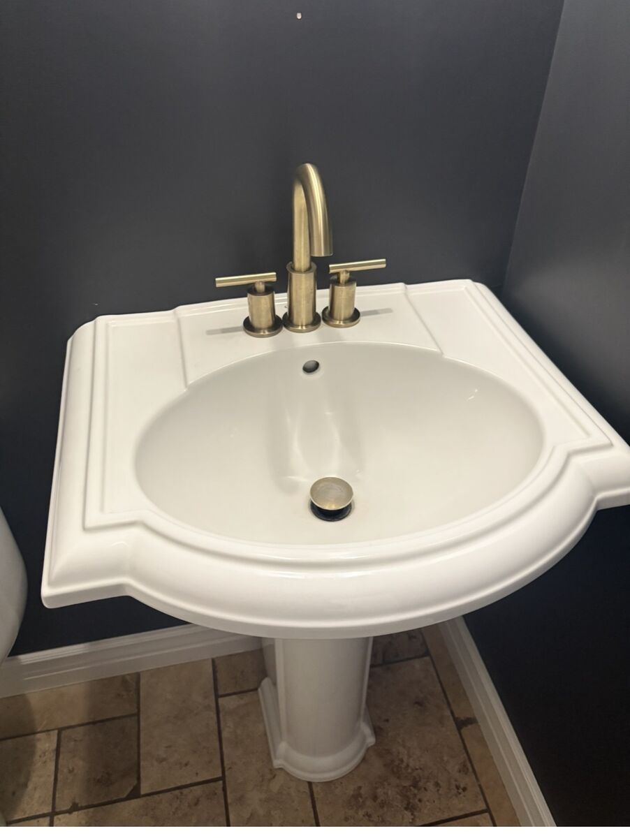 Pedestal sink and gold faucet…