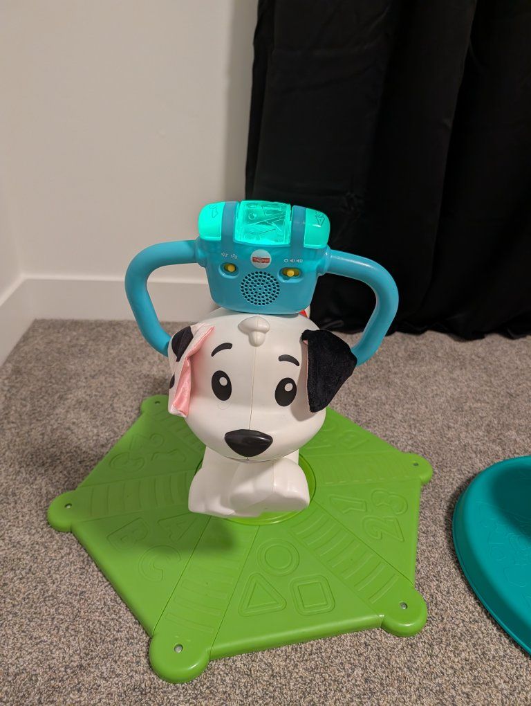 Fisher-Price Bounce & Spin Puppy Musical Ride-On Toy