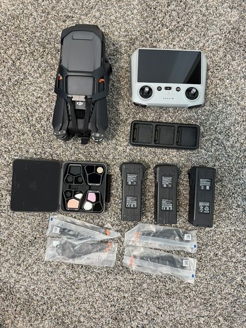 DJI Mavic Pro 3 with Controller, three batteries, charger, lenses, and new extra blades.
