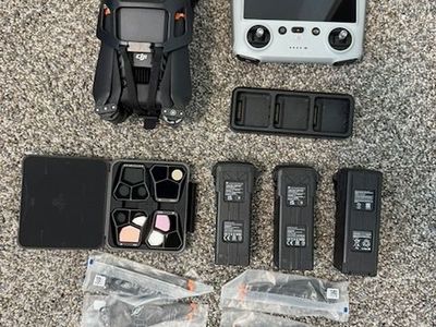DJI Mavic Pro 3 with Controller, three batteries, charger, lenses, and new extra blades.