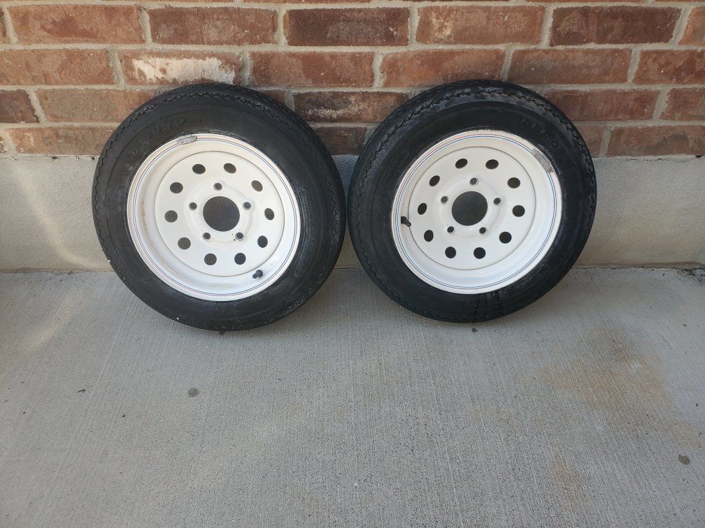 2 trailer wheels and tires