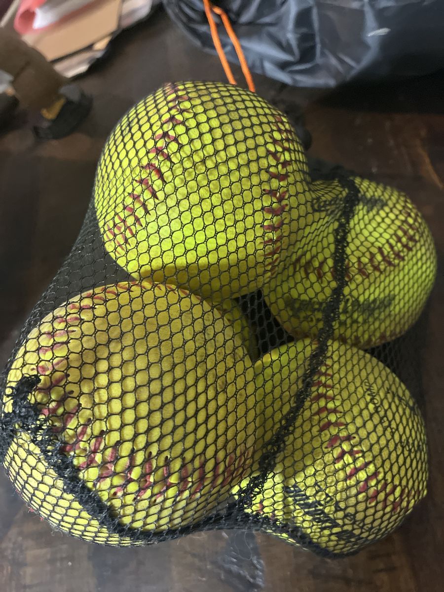 13 Used Practice Softballs - Yellow with Red Stitching, in Mesh Bag