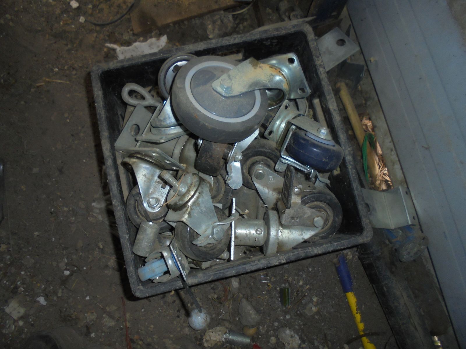 Black crate full of heavy duty castors