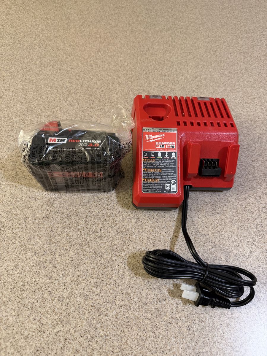 Brand new Milwaukee M18 Charger and 3AH battery