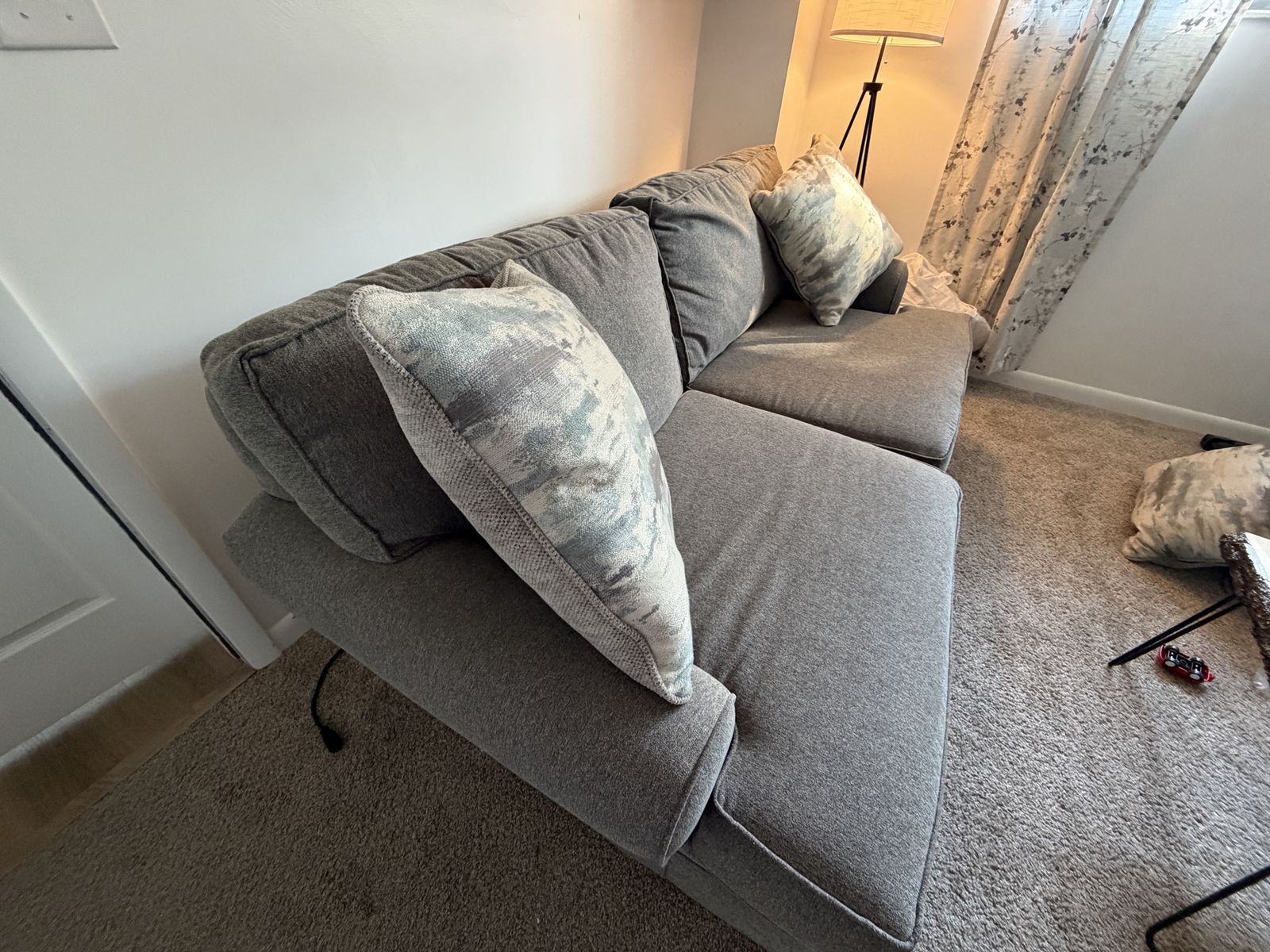 Haverty’s Gray Fabric Sofa with Bolster Arms and Accent Pillows