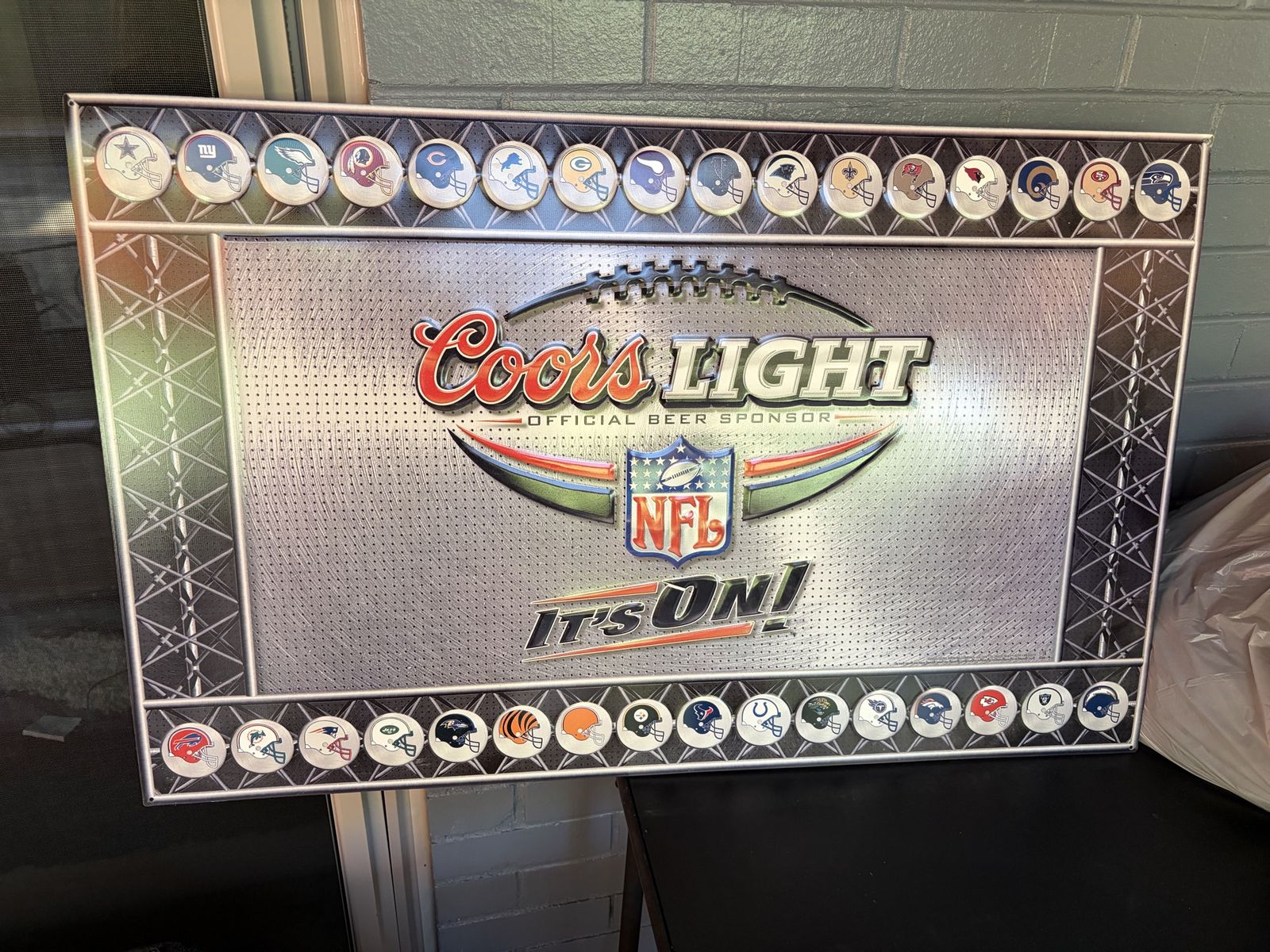 Embossed metal Coors light NFL tin sign