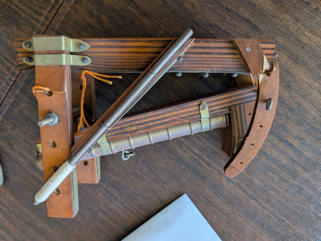 cannon with wooden base and ram rod