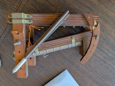 cannon with wooden base and ram rod