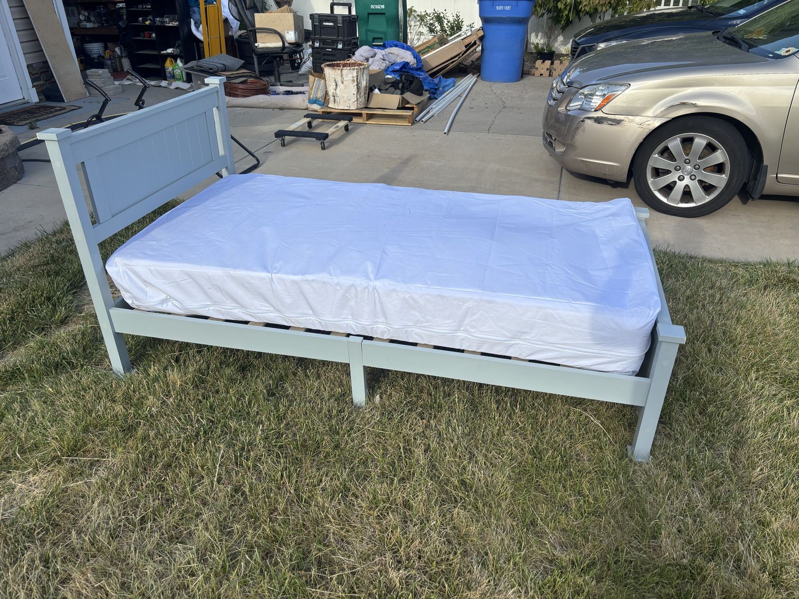 Less lightweight TWIN wood slat bed with new mattress cover and new topper + Never Used