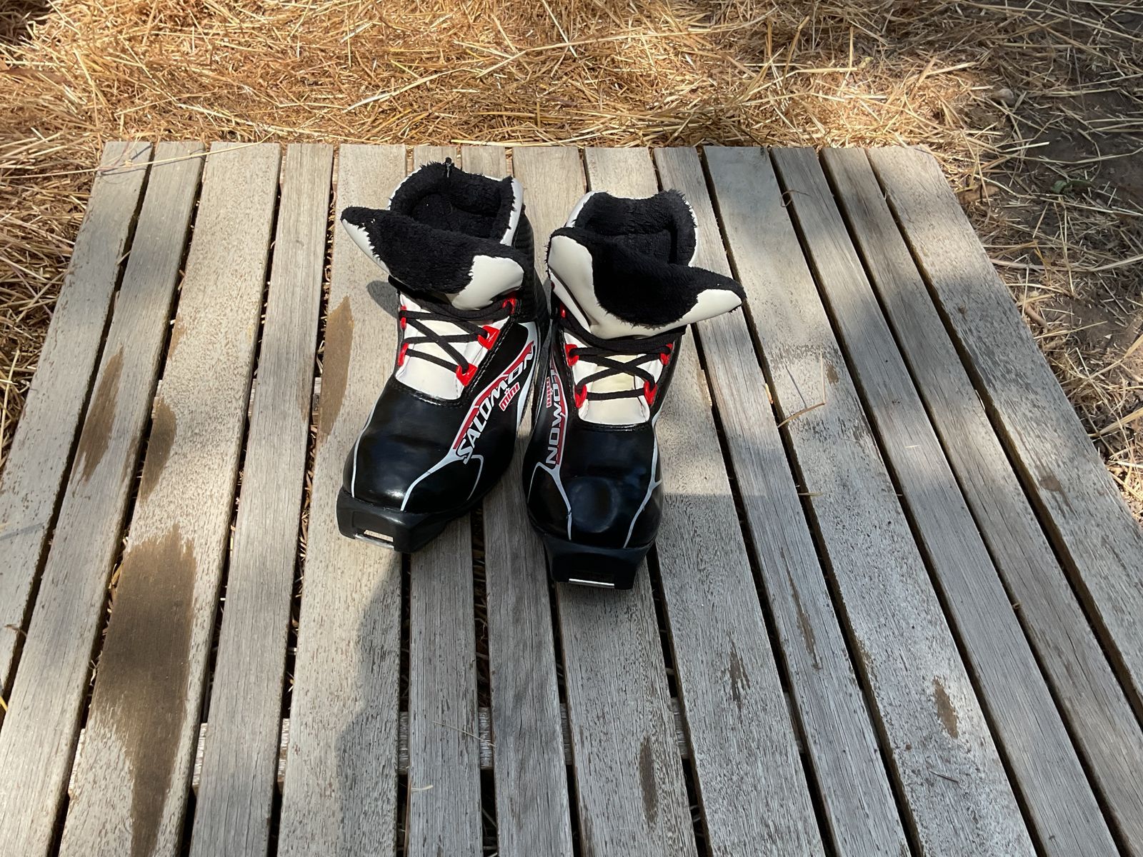 black, white, and red NNN cross country boots