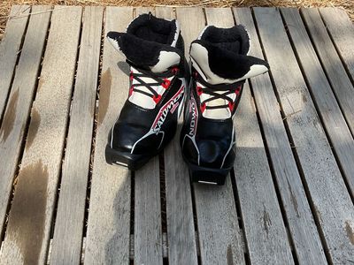 black, white, and red NNN cross country boots