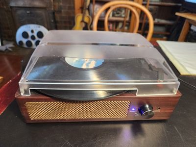 Gorgeous wood Bluetooth Turntable Record Player with built in speaker. Works and sounds great. Excellent needle.