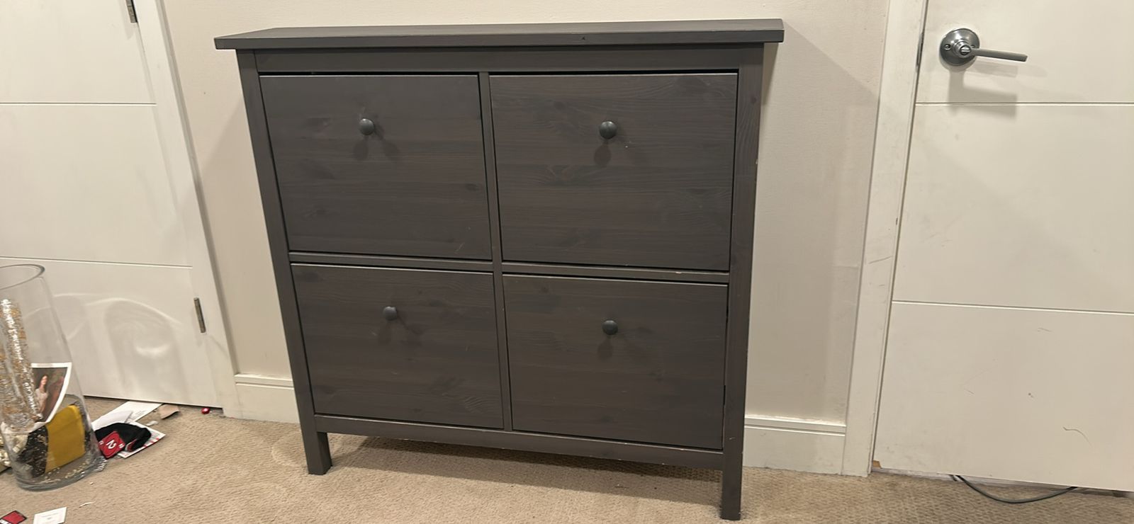 Grey IKEA shoe cabinet with four compartments