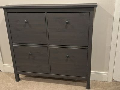 Grey IKEA shoe cabinet with four compartments
