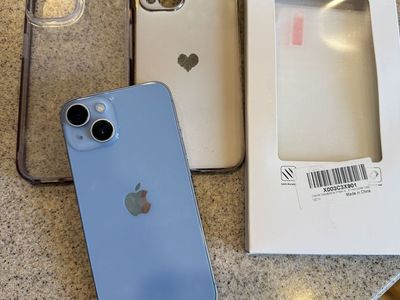 Unlicked iPhone 14 with 3 screen protectors, 4 cases