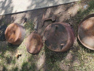 Rusty cast iron pans and likely Asian