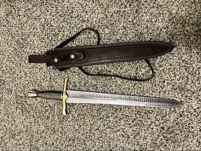 Short sword with leather sheath and strap