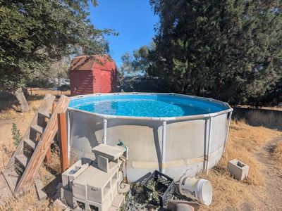 Above ground 16' x 4' pool with pump and ladder, ready for summer fun