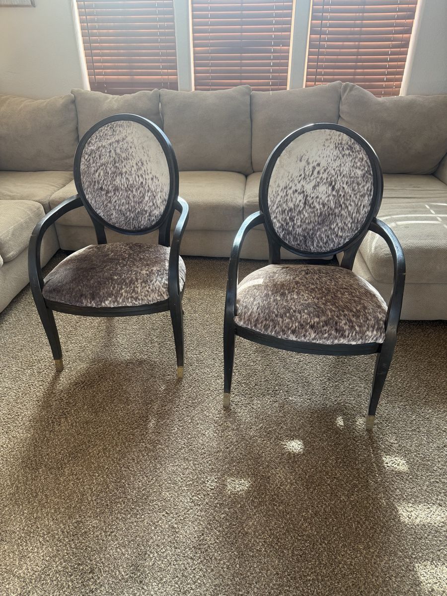 Pair of Cowhide Accent Chairs - Black Wood Frame, Gold Accents