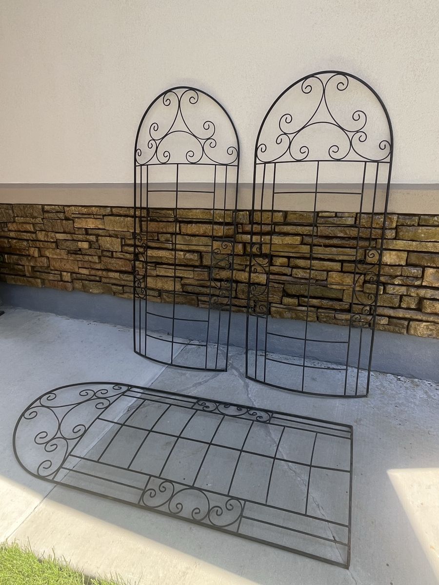 Scroll rounded decorative tall trellises we leaned against a fence 67” T 29” W $65 each