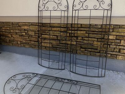 Scroll rounded decorative tall trellises we leaned against a fence 67” T 29” W $65 each