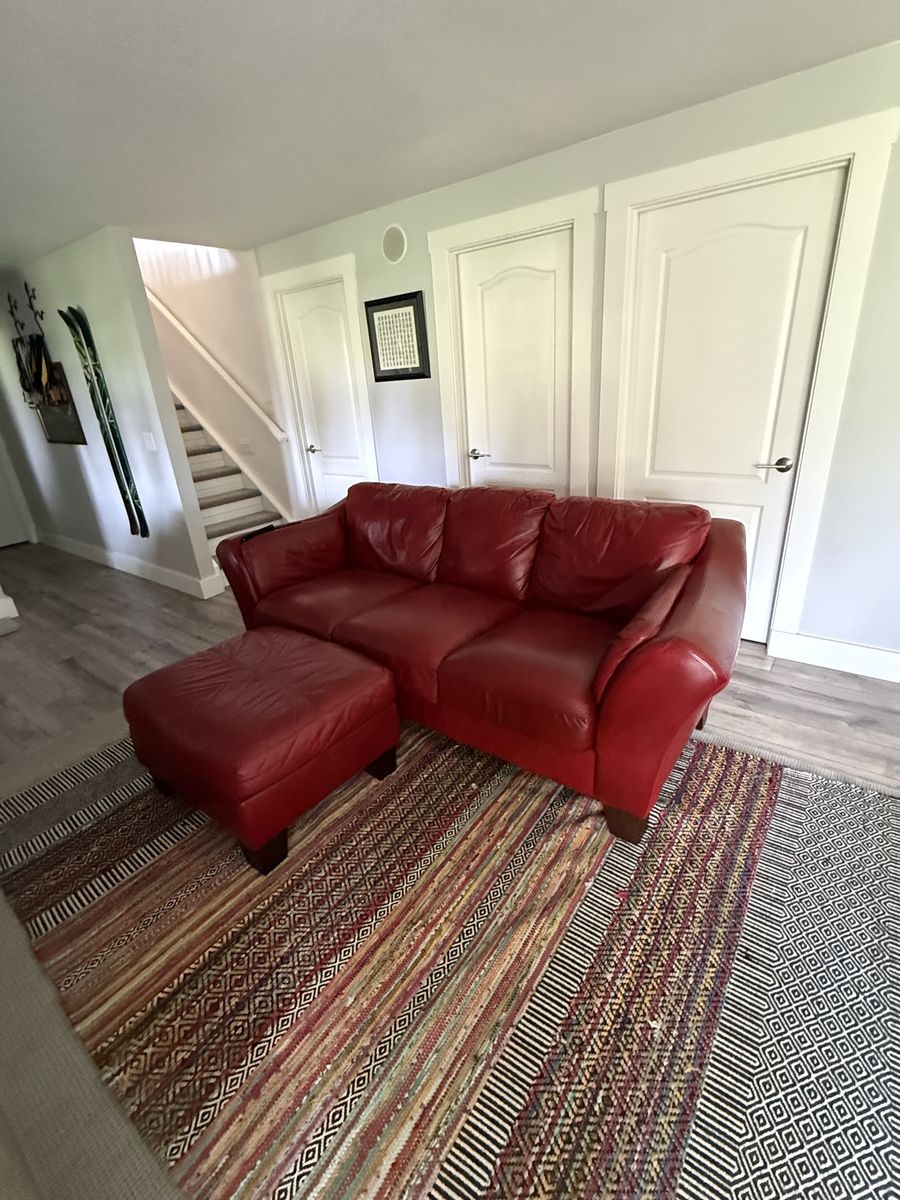 Red leather couch and ottoman