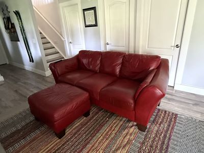 Red leather couch and ottoman