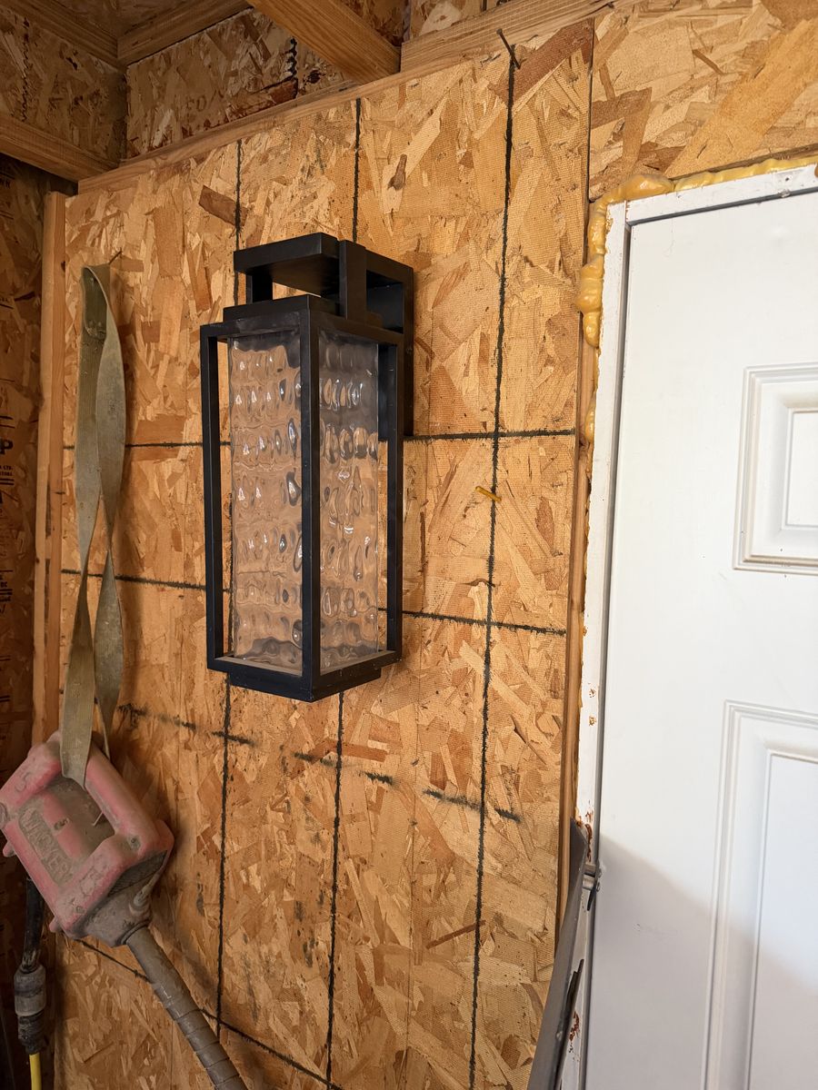 Black Metal Outdoor Wall Lantern Sconce with Textured Glass Panel
