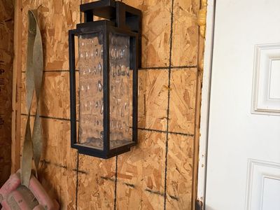 Black Metal Outdoor Wall Lantern Sconce with Textured Glass Panel