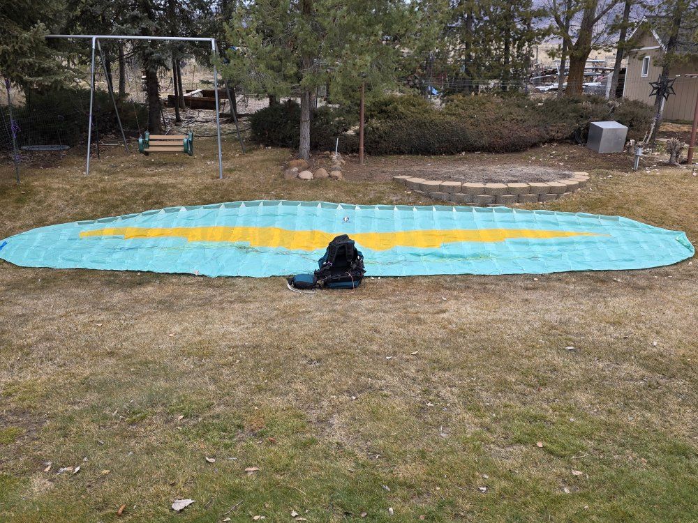 Paragliding wings and harnesses