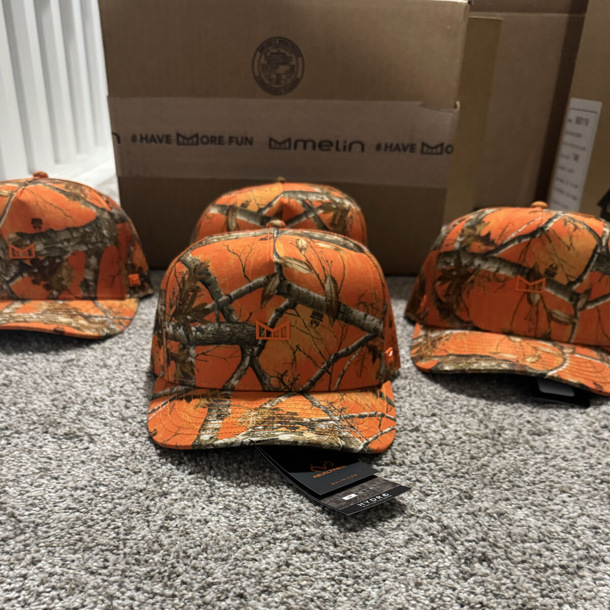 Melin x Realtree Orange Camo hats