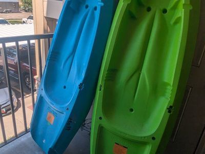 2 Lifetime Youth Kayaks (Blue & Green) with 2 Youth Life Vests and oars.
