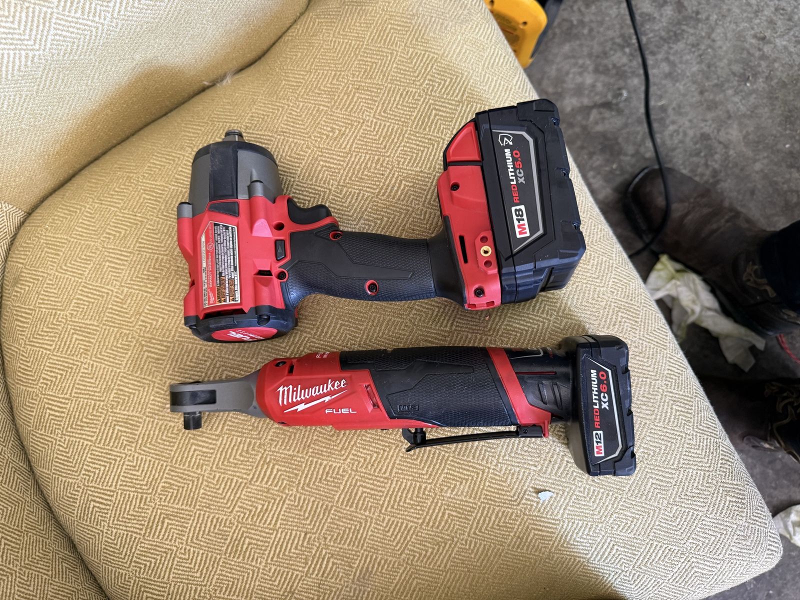 Milwaukee M18 FUEL 2767-20 1/2" Impact Wrench and M12 FUEL 2557-20 3/8" Ratchet with Batteries