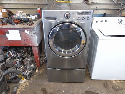 LG front load electric dryers on pedestals
