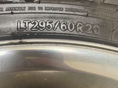 Toyo Open Country A/T LT295/60R20 Tires on Chrome Dodge Wheels