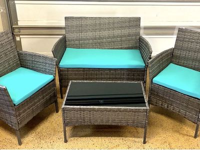 4-Piece Outdoor Wicker Patio Furniture Set with Teal Cushions and Glass Top Coffee Table