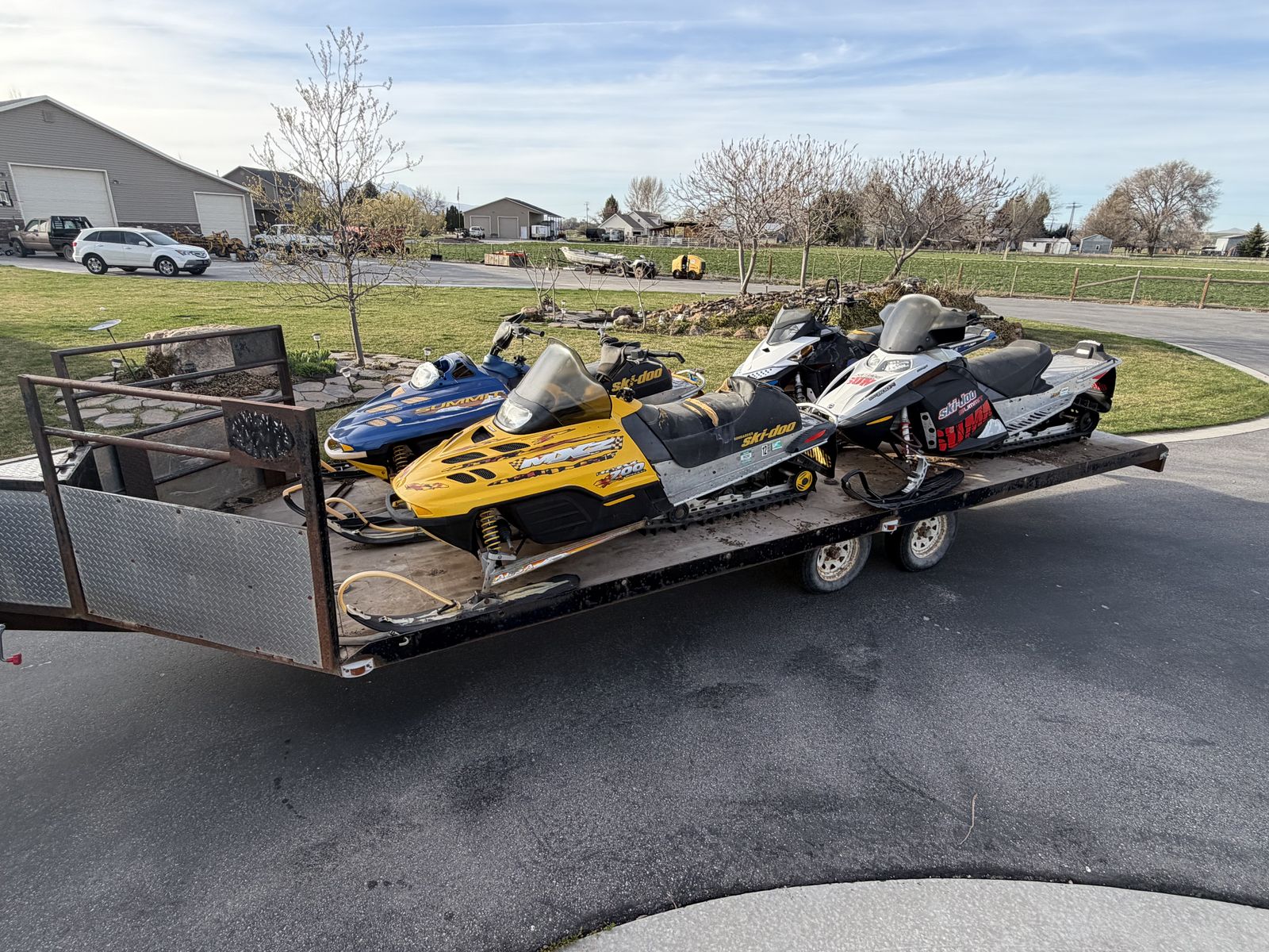 4 snowmobiles And Trailer