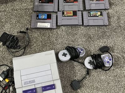 Super NES console and 8 games