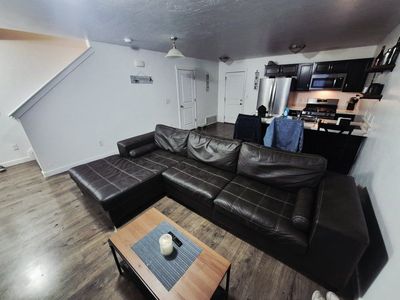 Dark Brown Leather Sectional Sofa with Chaise and White Stitching